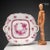 Porcelain tray decorated with a basket of flowers and plant motifs in deep pink tones and gold highlights. Handles shaped...