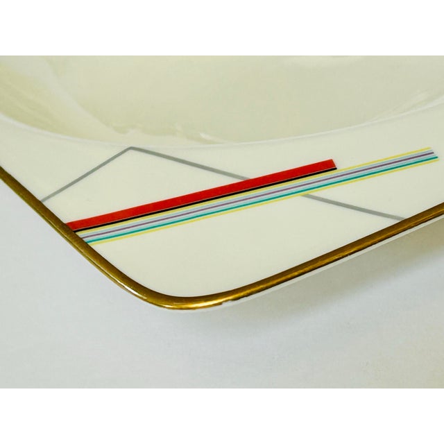 Pair of designer Daniel Hechter rimmed bowls from Paris with a Bauhaus pattern on the extended rims and gold highlight on...