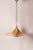 The large “Semi” ceiling lamp, designed in 1968 by Danish architects Claus Bonderup and Torsten Thorup for Fog & Mørup....