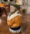 Full of humor and character, this antique barbotine pitcher takes the form of a jovial sailor standing in a confident,...