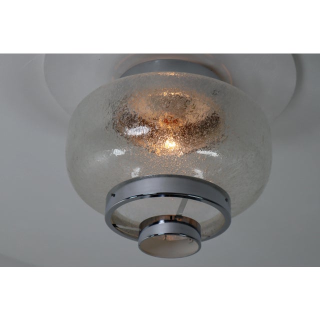 Set of 30 glass flush mount. with controlled bubble glass shade and chrome mounts. The sheets beautifully refracting...