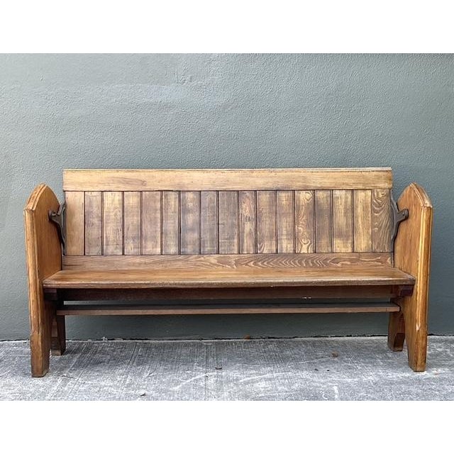 This exceptional vintage train station bench is a masterclass in early 20th-century industrial design, featuring the...