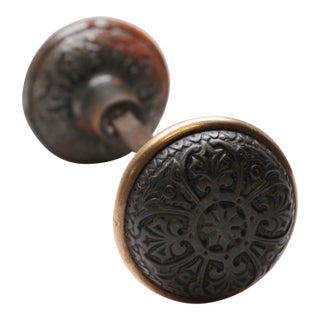 Pair of Cast Iron 4 Fold Door Knobs With a Bronze Rim For Sale
