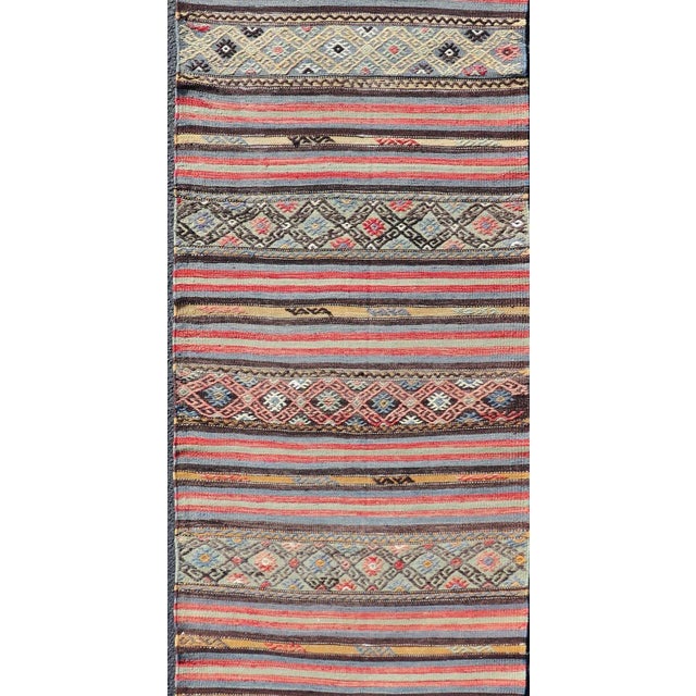 Vintage Turkish Kilim with Horizontal Stripes and Tribal Motifs in Bright Tones. Hand Woven vintage Turkish Kilim in...