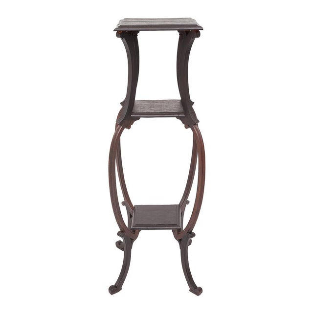 Walnut side table. Art Nouveau. Three square shelves: 31, 24, and 21 cm per side. Wide, ornate legs. Circa 1900