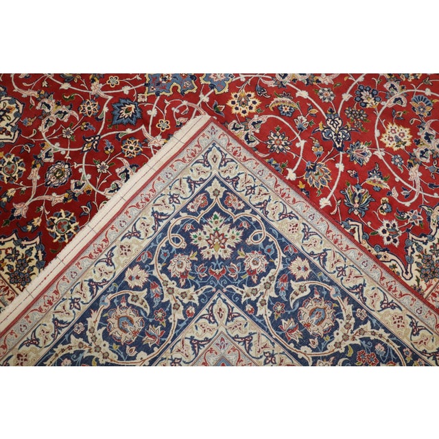 A beautiful, Fine Persian Isfahan from the 1940s. The writing on the rug is in Persian (Farsi) script. It appears to be a...