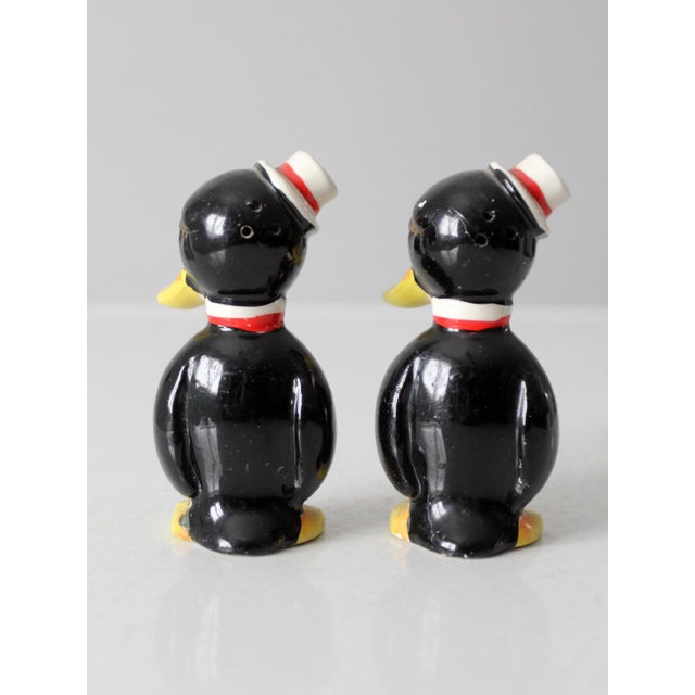 This vintage mid-century penguin salt and pepper shaker set from Japan features a playful, storybook-inspired design full...