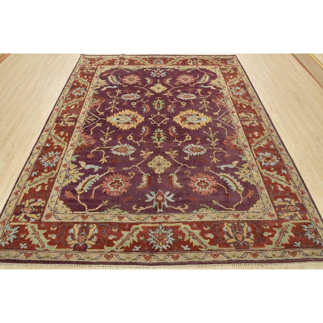 This traditional Oushak rug is hand-knotted with an all-wool pile on a cotton foundation. This rug is new and in excellent...