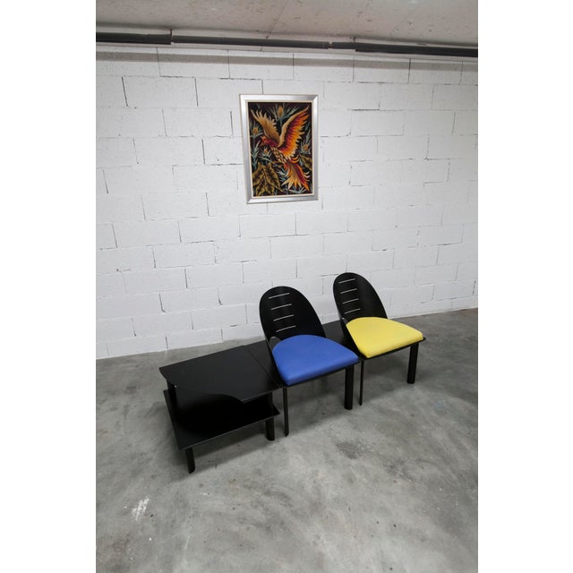 Set of 2 armchairs and matching coffee table designed by Patrice Bonneau, Genexco edition 1980. The 3 elements are made of...