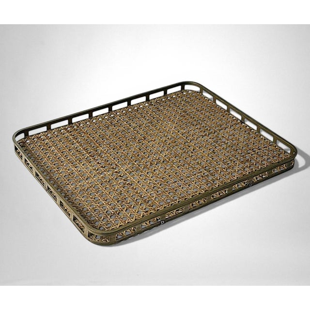 Elegant and refined tray featuring a solid lacquered brass frame that encloses a clear lucite panel, within which an...