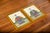 A striking matched pair of vintage Chinese portraits depicting a seated male and female figure in elaborate Qing-style...