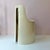 An iconic Space Age 1970's cream molded plastic chair, attributed to designer Kay Leroy Ruggles as part of his "UMBO"...