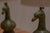 Elegant pair of French mid-century table lamps crafted in green patinated bronze, sculpted in the shape of stylised Asian-...