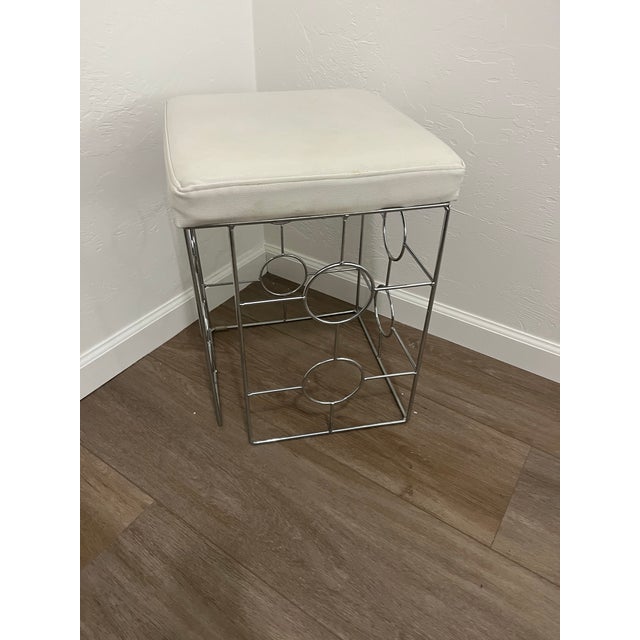 Hollywood Regency vanity make-up seat. Square shape white faux leather cushion attached to silver rectangular shaped metal...