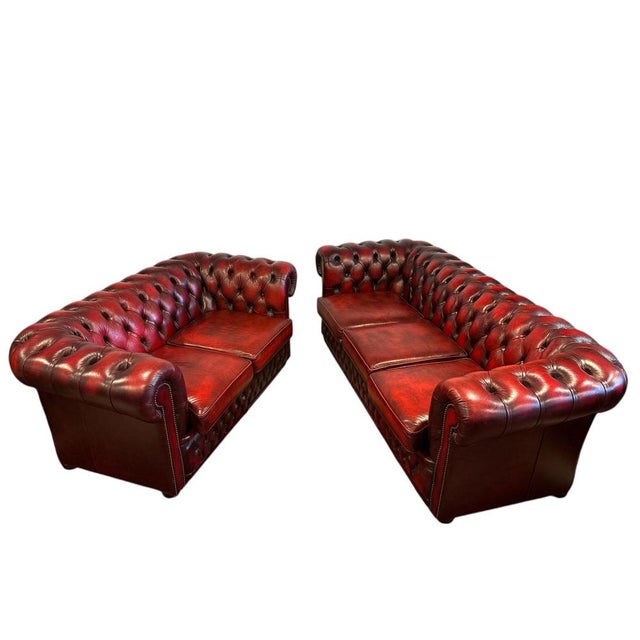 Genuine leather with deep button tufting. Traditional chesterfield with rolled arms and studded detailing three-seater...