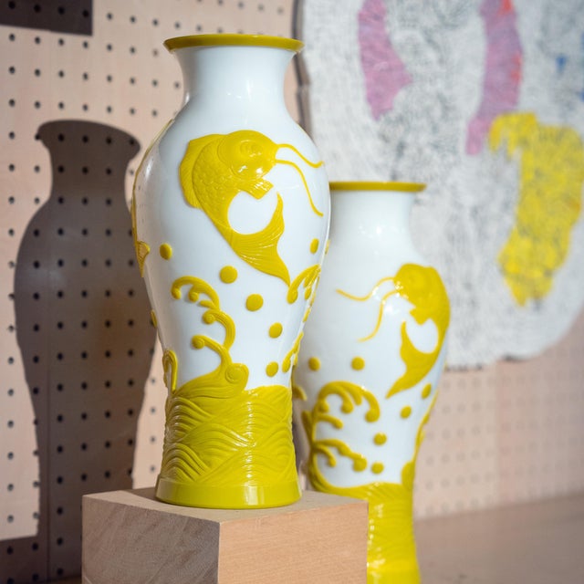 Expertly sculpted of Chinese Peking glass, these elegant vases from the early 20th century are aglow with brilliant yellow...