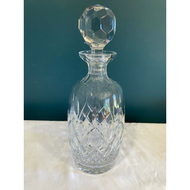 This vintage cut crystal decanter features a diamond-patterned body and a large faceted stopper that adds both function...
