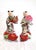 This is a pair of vintage Chinese porcelain statues of boys carrying offerings are post-1940..They are so charming. The...