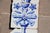 Baroque Antique 18th Century Blue & White Set of Four Tiles With Angel Above Flower Vase For Sale - Image 3 of 6