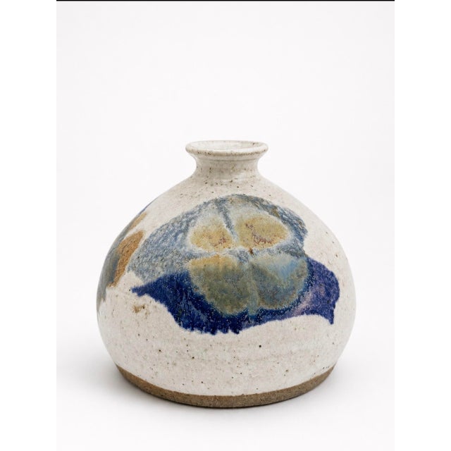 Small handcrafted stoneware vase by Kravec Studios of Naples, Florida. The rounded form has a softly flared rim and a...