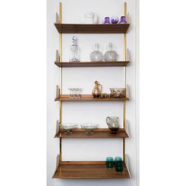 E60 bookcase – osvaldo borsani for tecno, 1954 walnut, leather, brass – a modular masterpiece of italian design step into...
