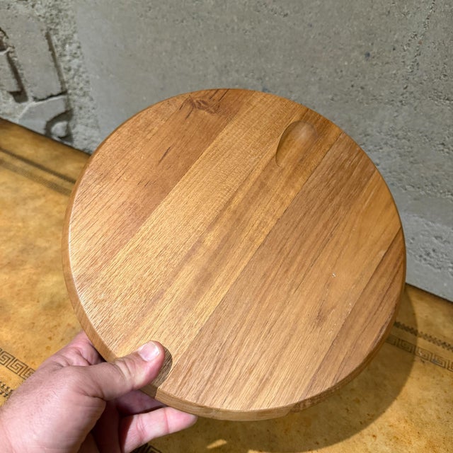 For your consideration, a vintage Danish Mid-century modern teak wood cheese board set with an integrated slicer, likely...