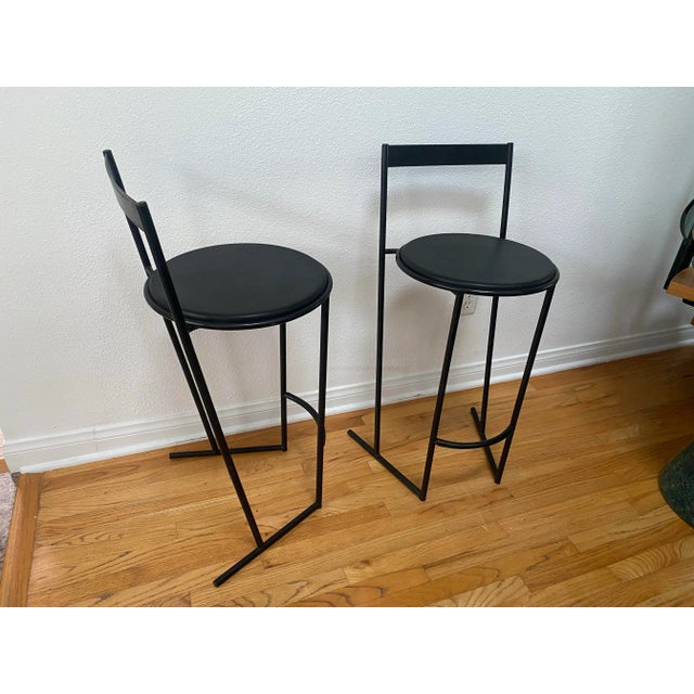 A sleek and highly collectible set of Italian postmodern counter stools designed by Emilio Nanni for Fly Line, known as...
