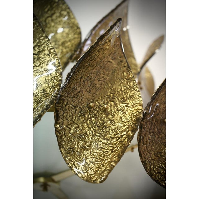 A riot of leaves, with an elegant gold colour. Very beautiful, rich and original design. Fantastic round chandelier in...
