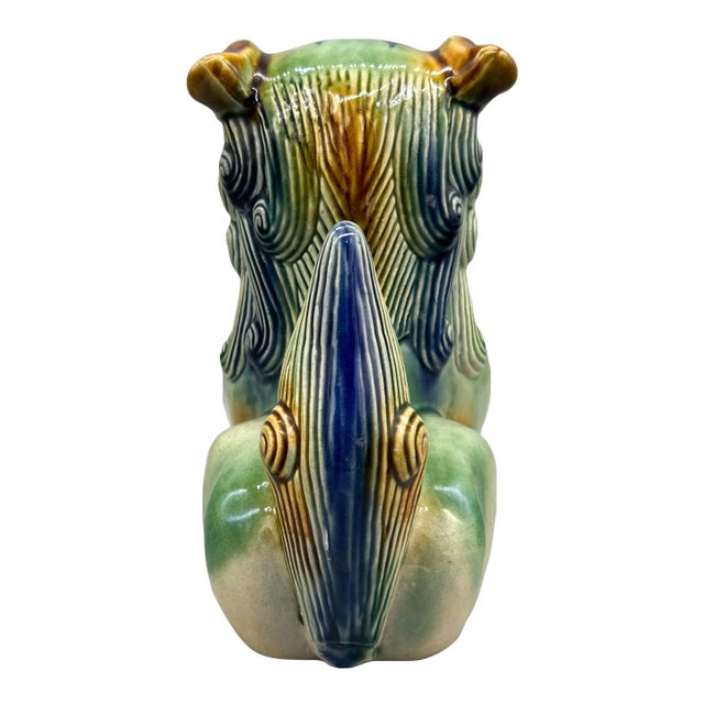 Handsome, vintage Chinese ceramic guardian lion, commonly called a foo dog, finished in a striking sancai-style glaze of...