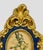 Mid‑20th Century European ornate Rococo‑style wood oval frame in royal blue with worn antique gilt highlights surrounding...
