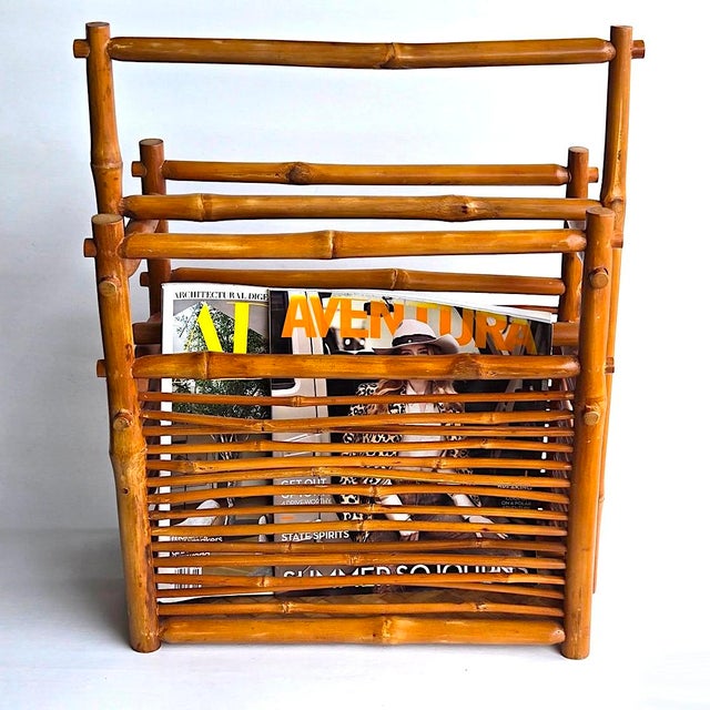 Offered is a vintage 1960s Paul Frankl style handled bamboo magazine rack with two compartments. It features bamboo wood...