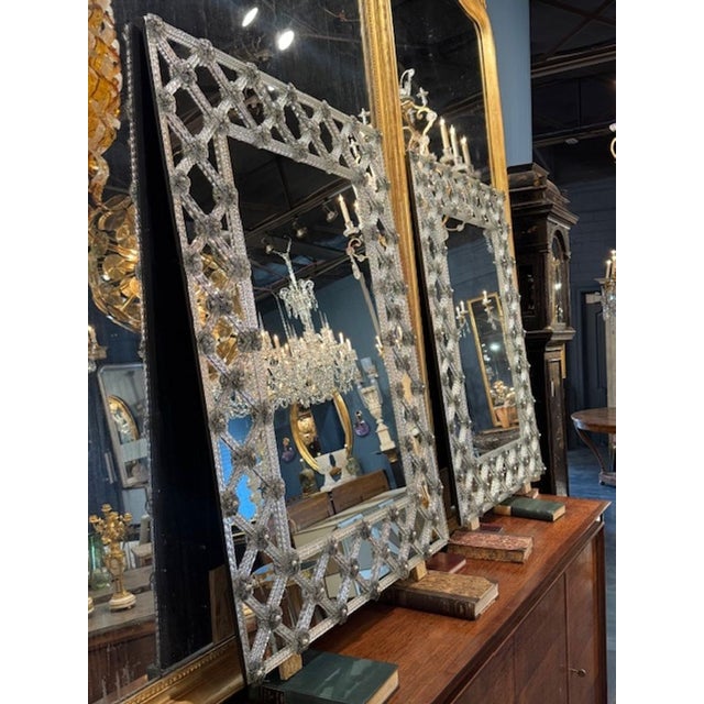 Pair of Italian Murano glass Lattice form mirrors. A pair of Italian Murano glass lattice‑form mirrors sits in a very...