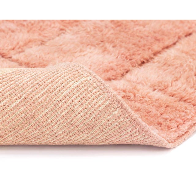 Elegant Hand-knotted wool rug with a gradient of Desert Bloom to Peach squares, interlaced with hand-woven detailing for a...