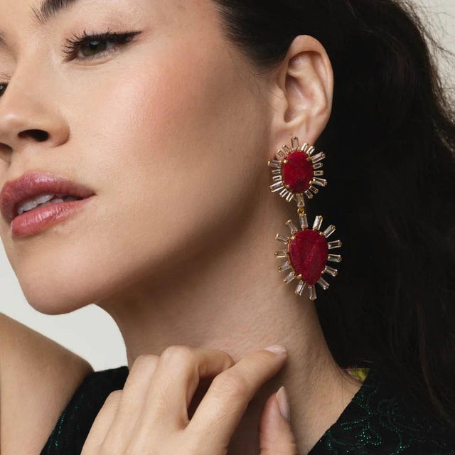 These large, statement-making earrings exude the timeless charm of art deco style, making a grand entrance wherever you...