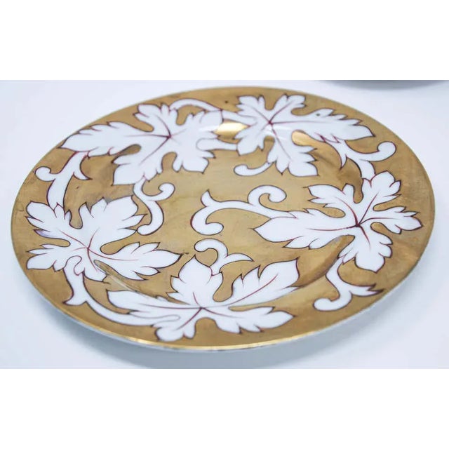 Fine gilt original porcelain coffee or tea cup with saucer and dessert plate. Enjoy the start to your day with the...