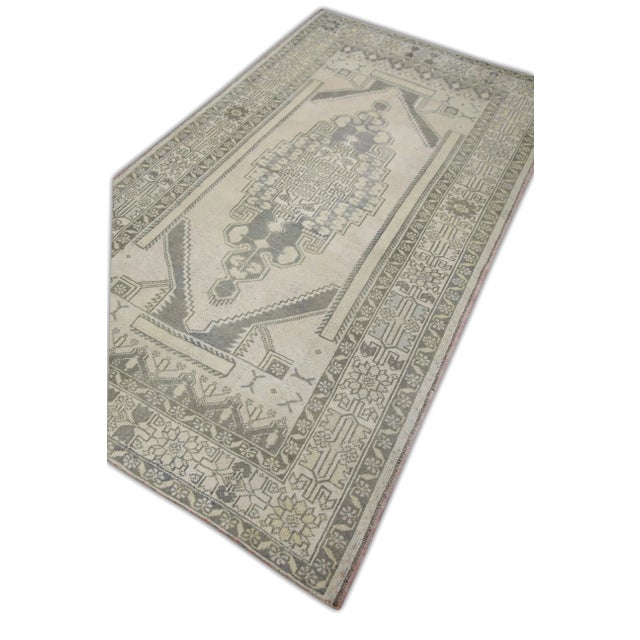 Introducing a one-of-a-kind vintage Turkish hand-knotted wool rug, carefully crafted by skilled artisans using traditional...