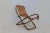 The Vintage Italian Leather and Wood Rocking Chair from the 1960s is a classic piece of furniture crafted in Italy. It...