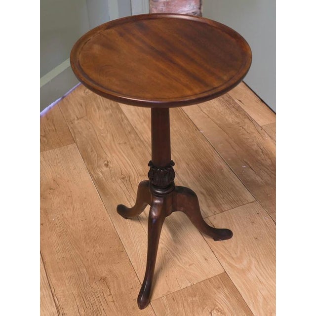 Petite Victorian Wine Table This lovely table stands on a three footed base which has an attractive turned centre leg. The...