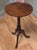 Petite Victorian Wine Table This lovely table stands on a three footed base which has an attractive turned centre leg. The...