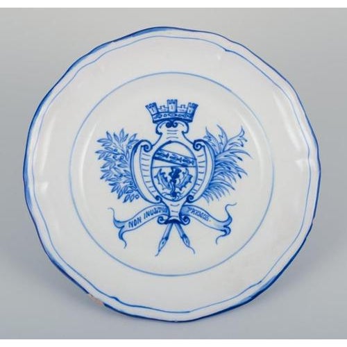 Emile Gallé for St. Clement, Nancy. A set of six dinner plates in hand-painted faience. Decorated with coat of arms....