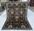 Persian Malayer design hand-knotted rug featuring a dramatic all-over repeat of coral and turquoise medallions connected...