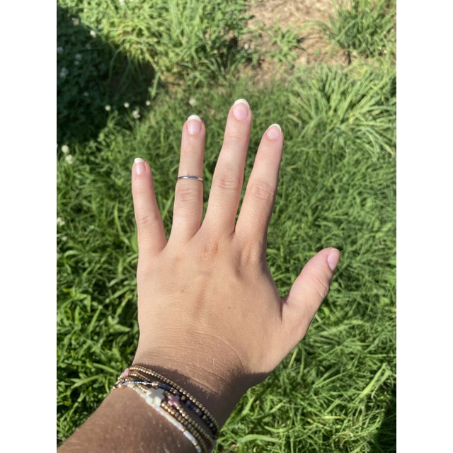 Ring Size 5.75 Rise Off Of Finger: 1.4 mm Width: 1.9 mm Weight: 1.7 dwts/ 2.6 grams Stamps: "Plat 950" SKU: R3938 A Couple...