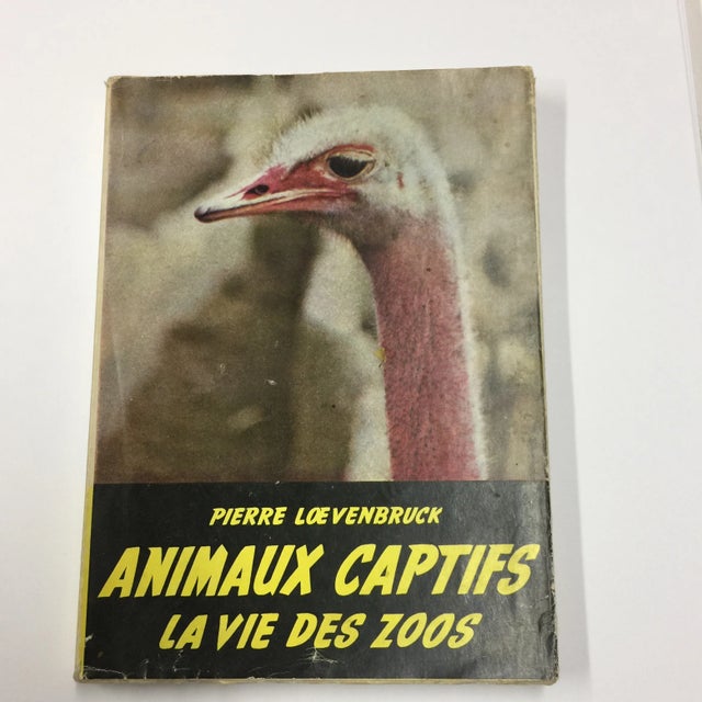 By Pierre Loevenbruck. Animaux Captifs La Vie Des Zoos. Paris: La Toison D'Or, 1954. Softcover with dust jacket. Text in...