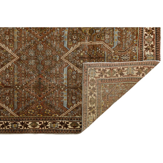 Exuding an air of understated elegance, this antique Malayer rug seamlessly bridges the gap between classic tribal...