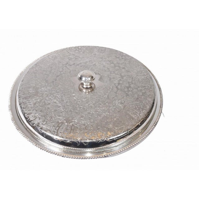 Amazing silver plate lidded tray or serving platter. Very intricte details to hand chased motifs on the lid with floral...