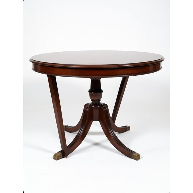 Stunning vintage Drexel “Chippendale” round pedestal dining table in rich mahogany with a high-gloss finish that’s ready...