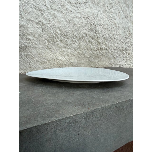 Triangular shape platter designed by Doriana and Massimiliano Fuksas for Alessi, Germany. The pattern is called...