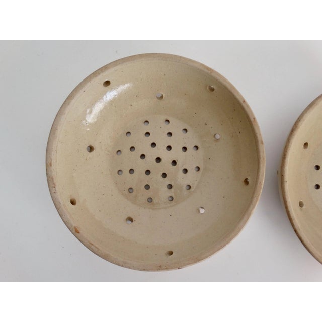 A set of 2 19th-Century French faience cheese molds, or moule à fromage. They are from Provence and are evocative of a...
