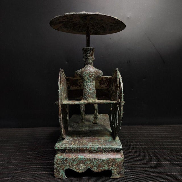 Step into history with this exquisite reproduction of a Chinese traditional bronze horse cart. This artistic piece...