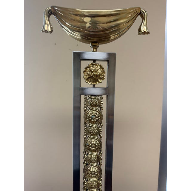 A one-of-a-kind hand-cast Ormolu table torchère crafted from solid brass, featuring intricate decorative detailing. The...